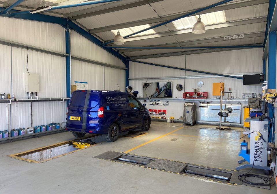 The MOT bay with brake tester and a liveried Richard T. Weaver van